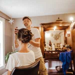 a woman getting her hair done